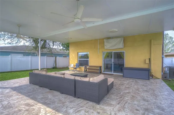 a view of outdoor space with swimming pool and furniture