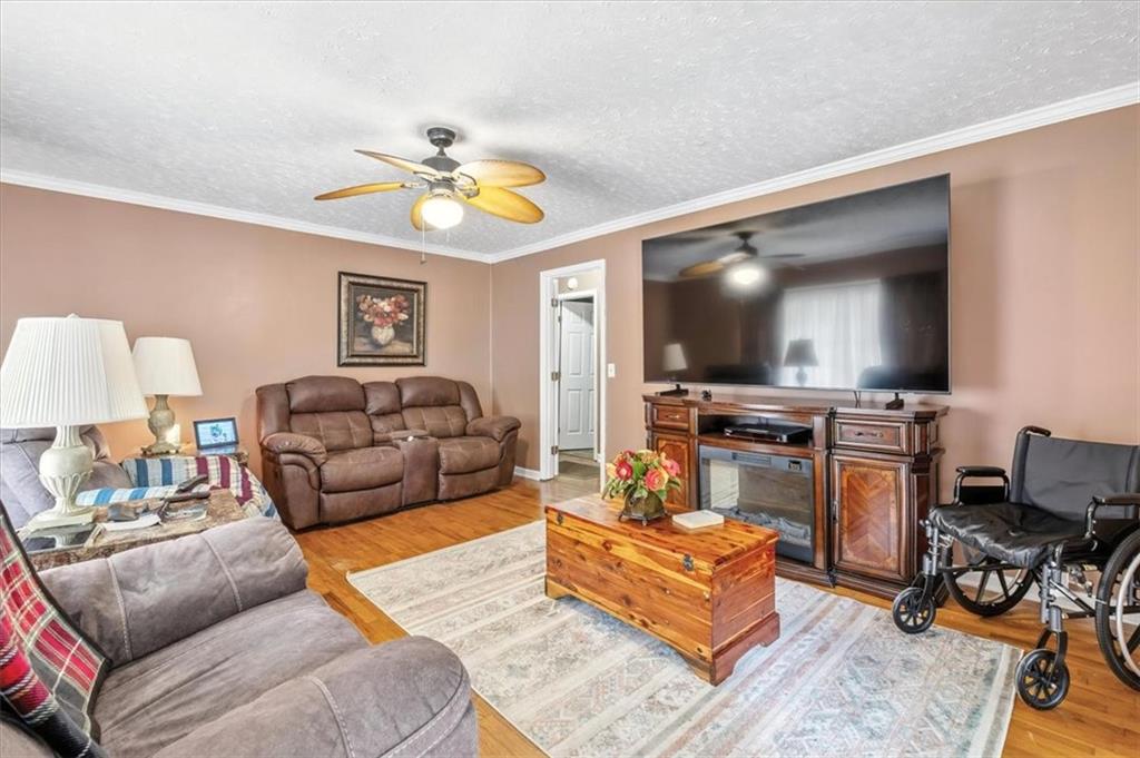 241 River Bend Road Southwest Plainville, GA 30733 - Photo 14 of 27 a living room with furniture and a flat screen tv