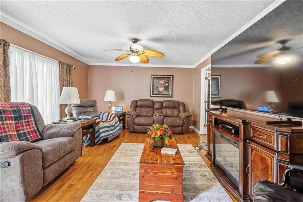 241 River Bend Road Southwest Plainville, GA 30733 - Photo 15 of 27 a living room with furniture and a flat screen tv