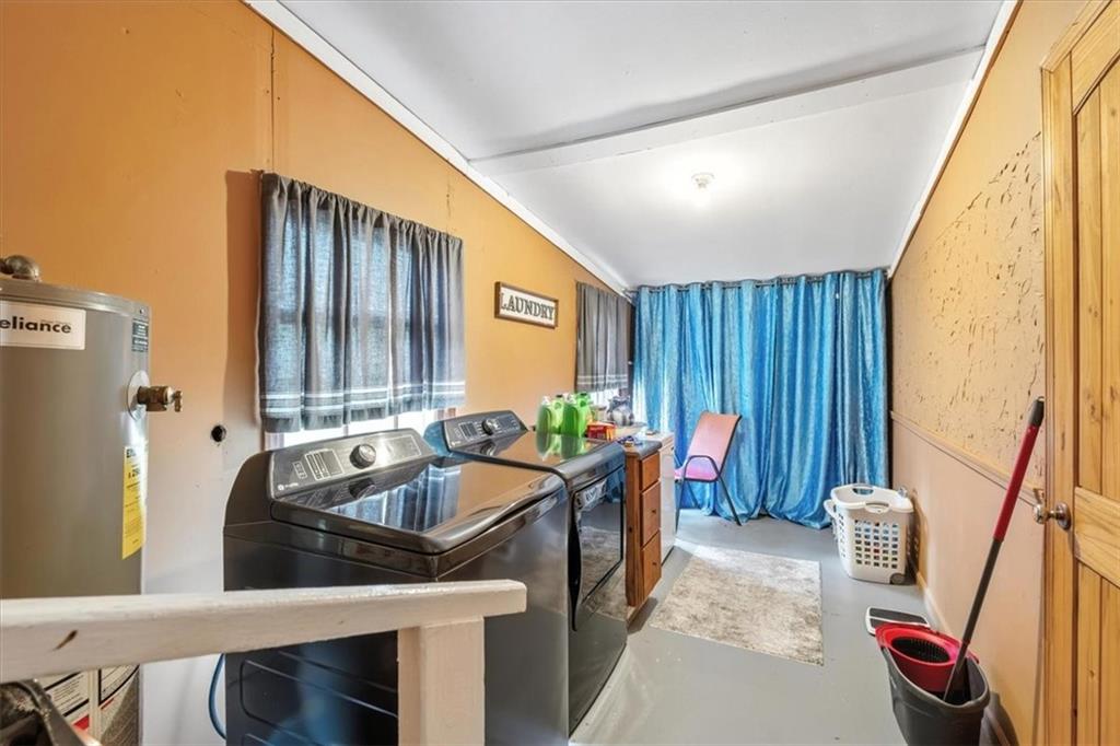241 River Bend Road Southwest Plainville, GA 30733 - Photo 20 of 27 a kitchen with a sink and a refrigerator