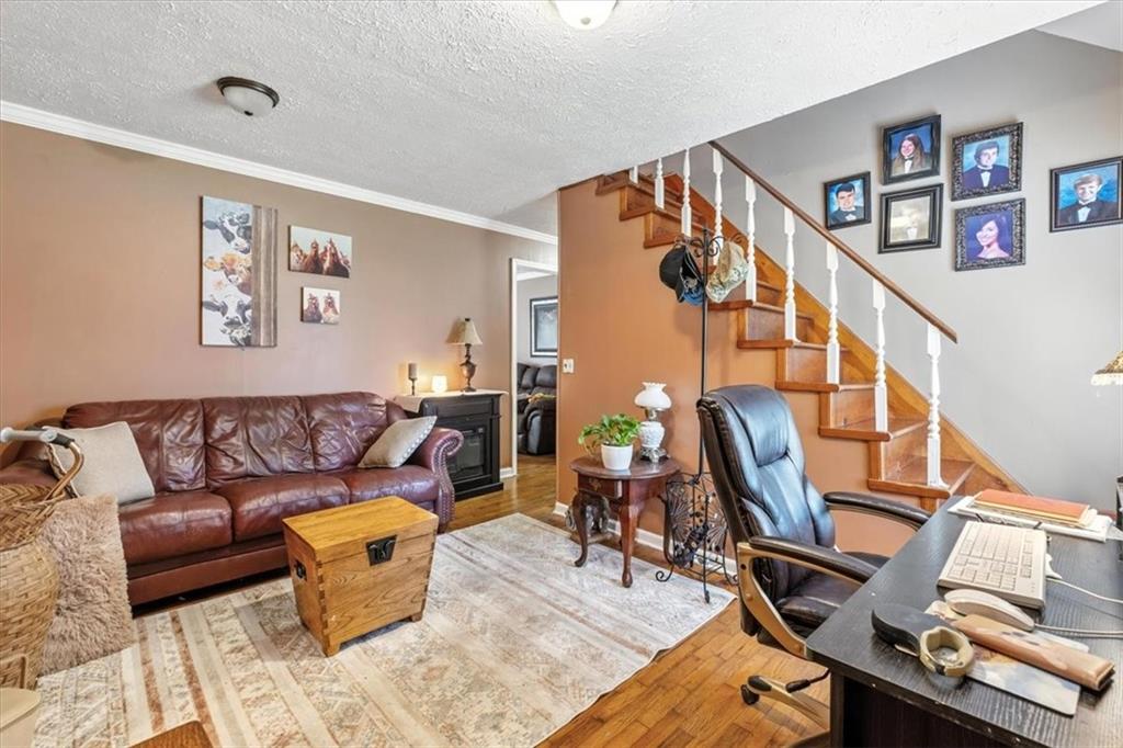 241 River Bend Road Southwest Plainville, GA 30733 - Photo 25 of 27 a living room with furniture and wooden floor