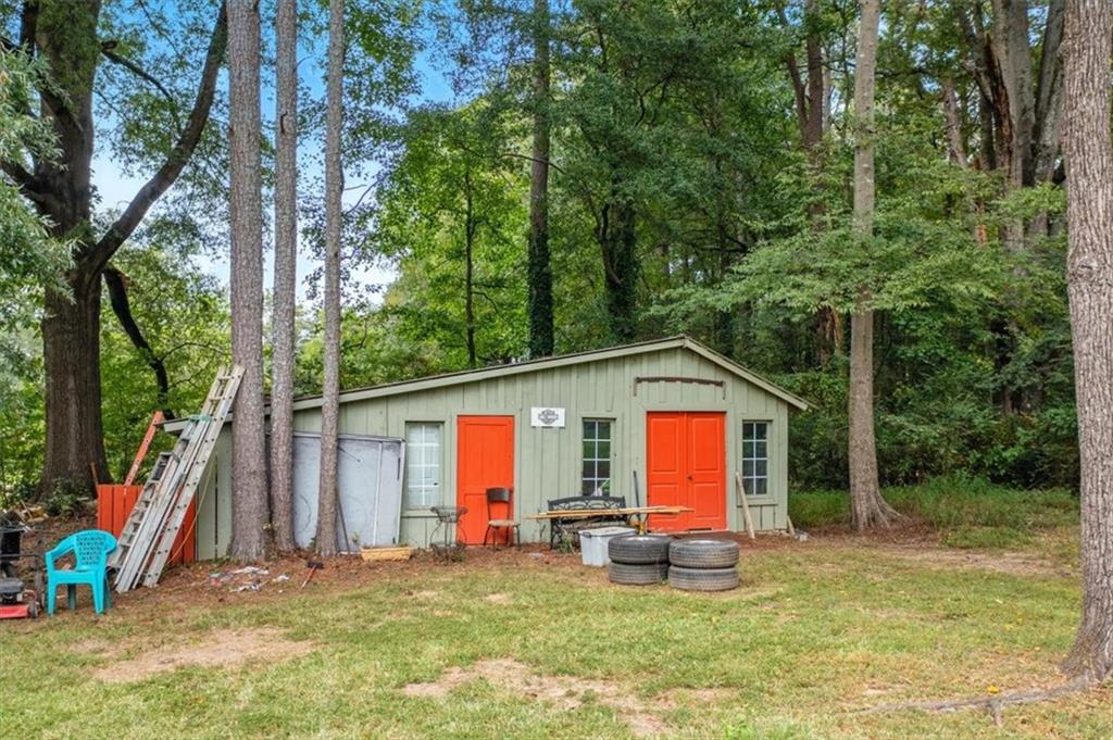 241 River Bend Road Southwest Plainville, GA 30733 - Photo 6 of 27 a view of a house with backyard porch and sitting area