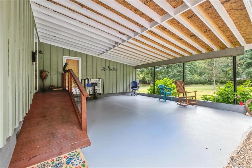 241 River Bend Road Southwest Plainville, GA 30733 - Photo 7 of 27 a view of a room with wooden floor and stairs