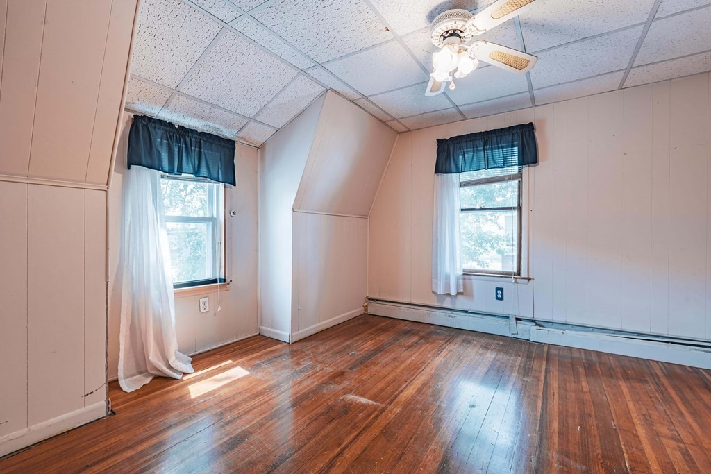51 Bay Road Revere, MA 02151 - Photo 14 of 34 an empty room with wooden floor and windows