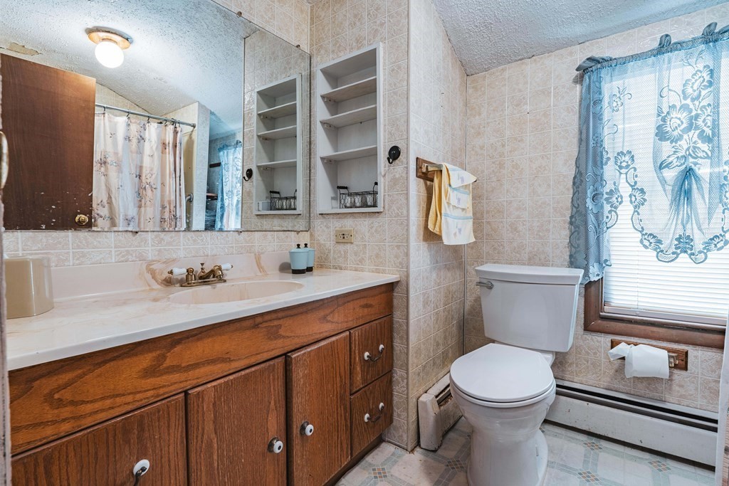 51 Bay Road Revere, MA 02151 - Photo 15 of 34 a bathroom with a sink a toilet and shower