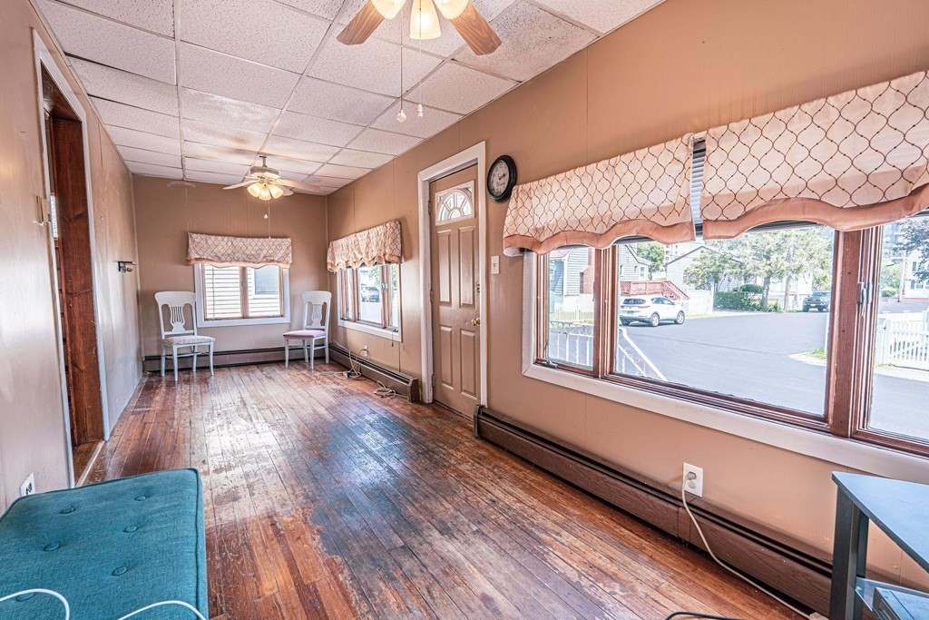 51 Bay Road Revere, MA 02151 - Photo 16 of 34 a view of a large room with wooden floor and windows