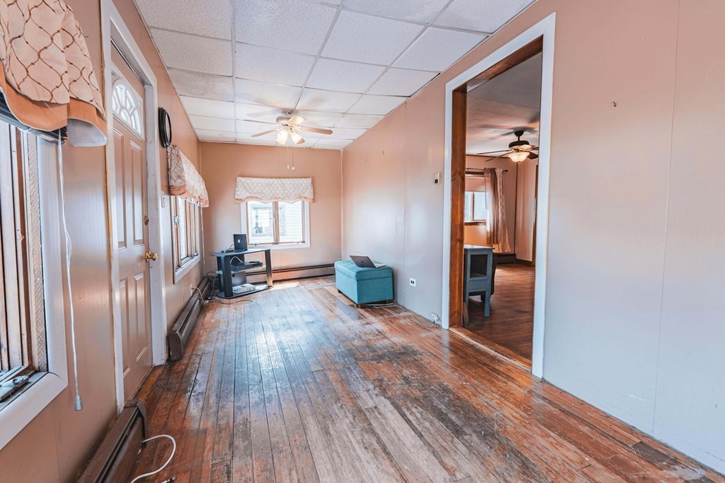 51 Bay Road Revere, MA 02151 - Photo 17 of 34 a view of a hallway with wooden floor and staircase