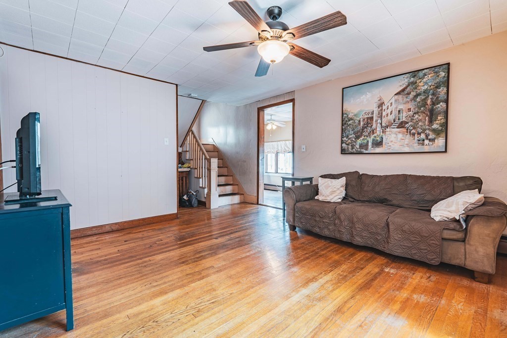 51 Bay Road Revere, MA 02151 - Photo 2 of 34 a living room with furniture and a chandelier