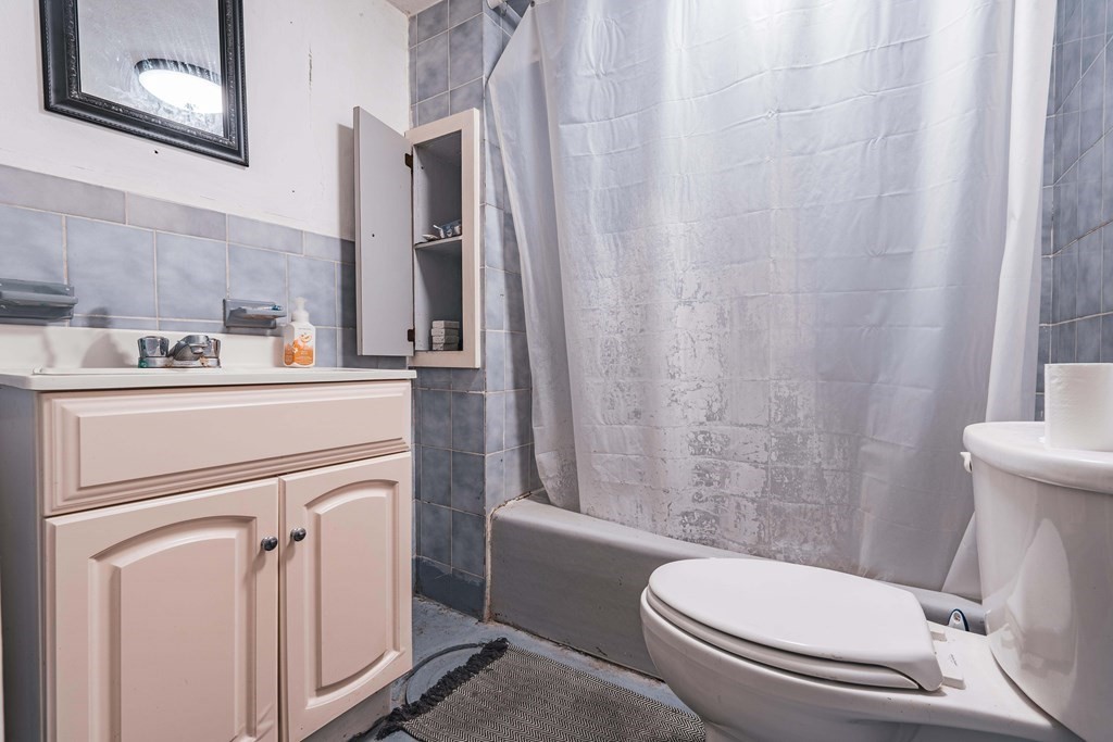51 Bay Road Revere, MA 02151 - Photo 26 of 34 a white toilet sitting next to a bathroom sink