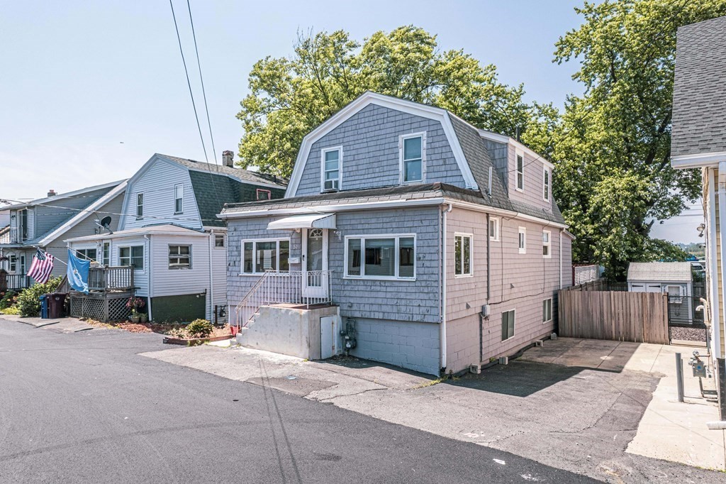 51 Bay Road Revere, MA 02151 - Photo 31 of 34 a front view of a house with a yard