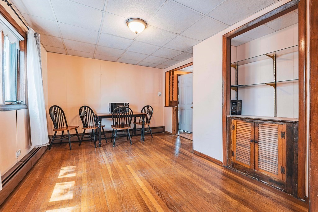 51 Bay Road Revere, MA 02151 - Photo 5 of 34 a dining room with furniture and a floor to ceiling window