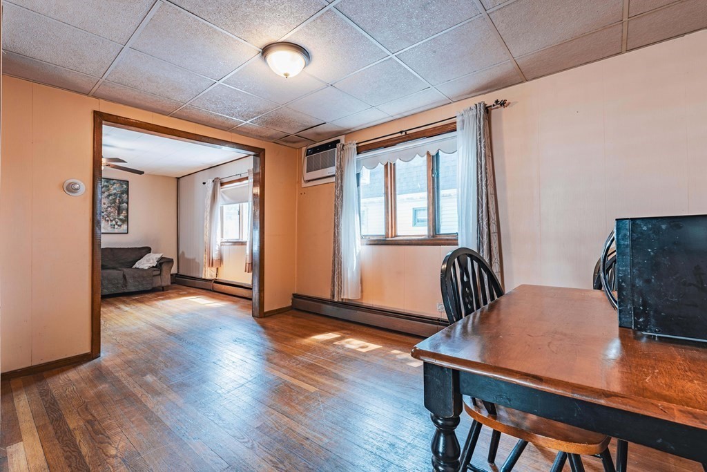51 Bay Road Revere, MA 02151 - Photo 6 of 34 a workspace with wooden floor and furniture