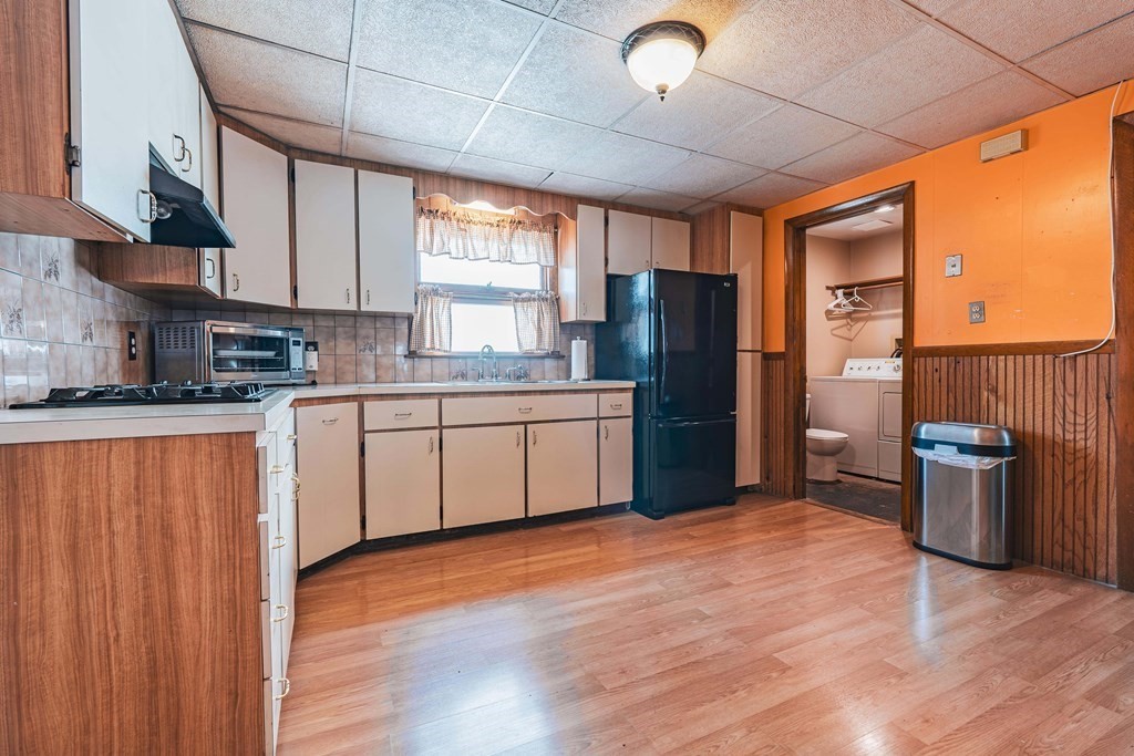 51 Bay Road Revere, MA 02151 - Photo 7 of 34 a kitchen with a refrigerator sink and stove
