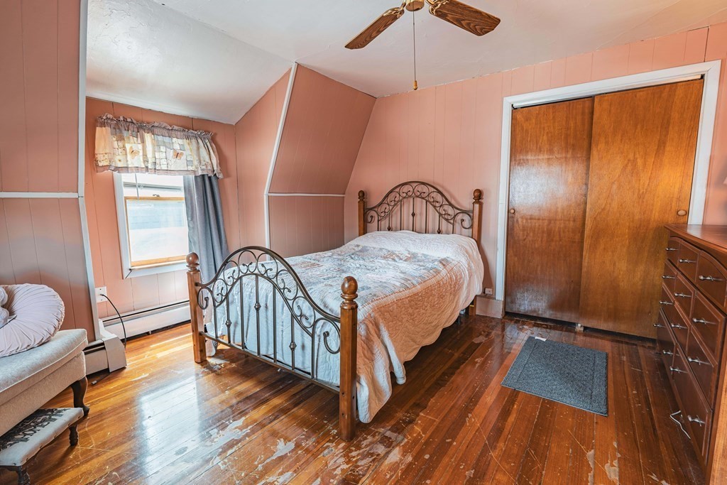 51 Bay Road Revere, MA 02151 - Photo 10 of 34 a bedroom with a bed and a window