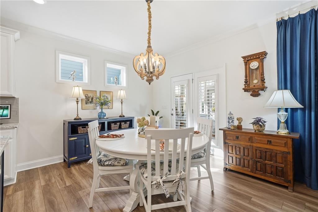 707 Evergreen Lane Canton, GA 30114 - Photo 12 of 59 a view of a dining room with furniture window and wooden floor