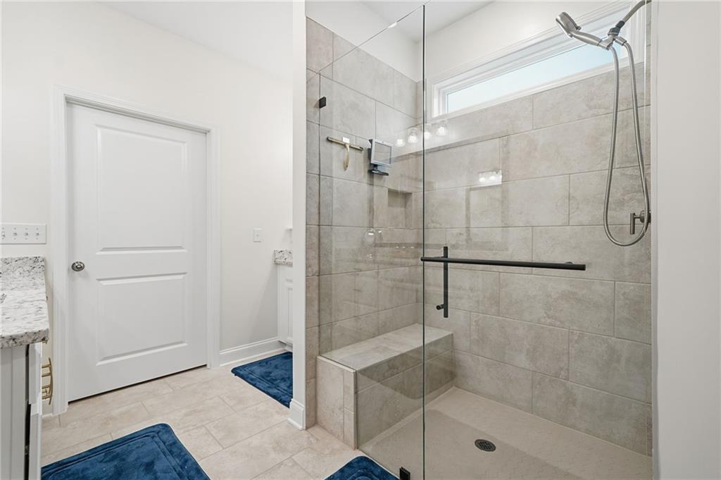 707 Evergreen Lane Canton, GA 30114 - Photo 25 of 59 a bathroom with a shower