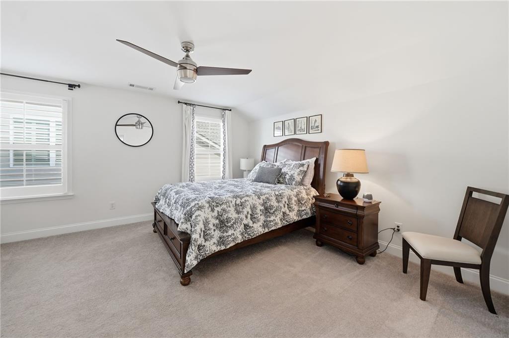 707 Evergreen Lane Canton, GA 30114 - Photo 30 of 59 a bedroom with a bed and a window