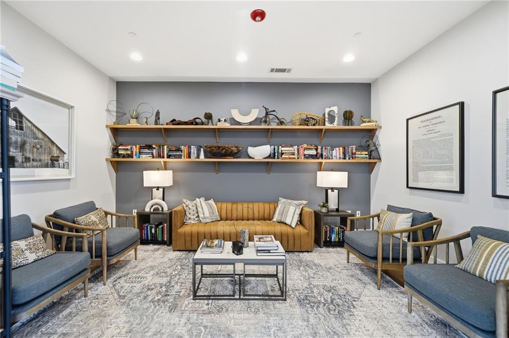 707 Evergreen Lane Canton, GA 30114 - Photo 42 of 59 a living room with furniture and painting on the wall