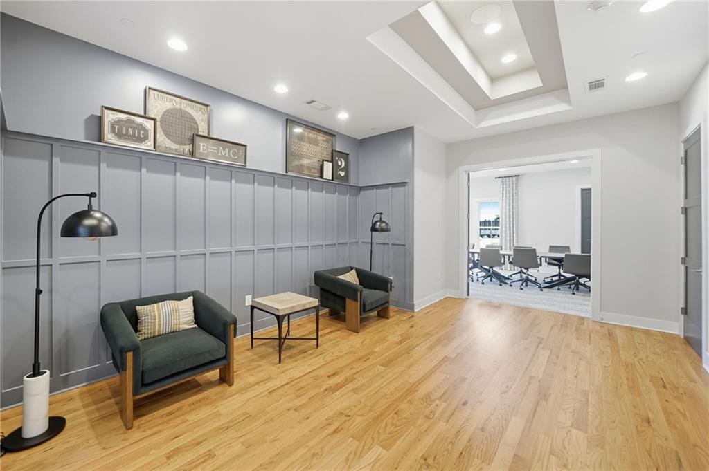 707 Evergreen Lane Canton, GA 30114 - Photo 46 of 59 a bedroom with furniture and a wooden floor