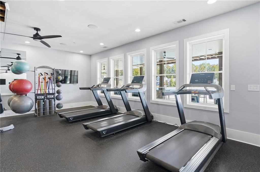 707 Evergreen Lane Canton, GA 30114 - Photo 49 of 59 a bedroom with furniture and large windows