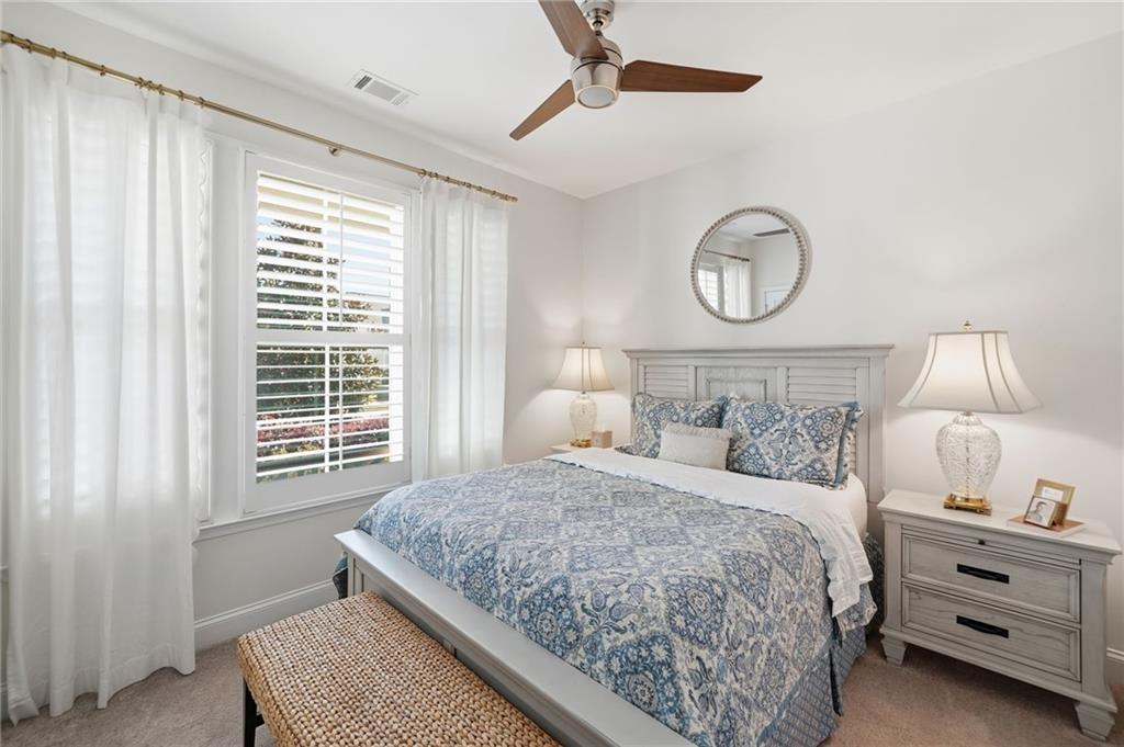 707 Evergreen Lane Canton, GA 30114 - Photo 5 of 59 a bedroom with a bed and a window