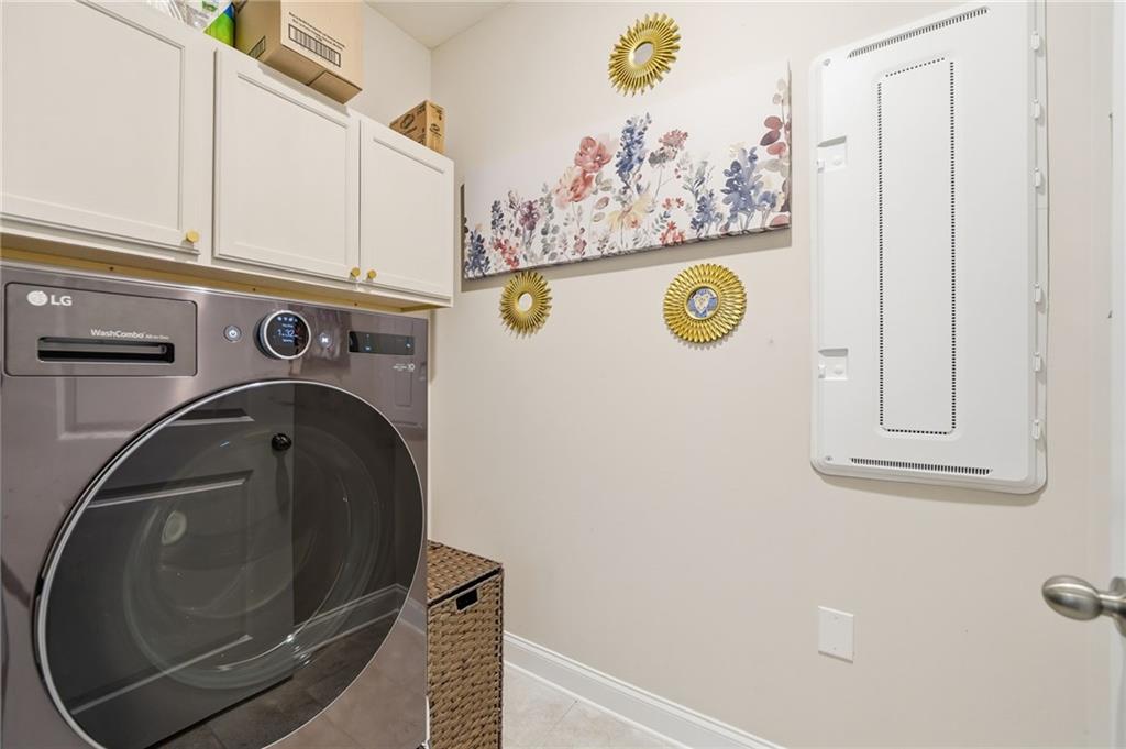 707 Evergreen Lane Canton, GA 30114 - Photo 7 of 59 a utility room with dryer and washer