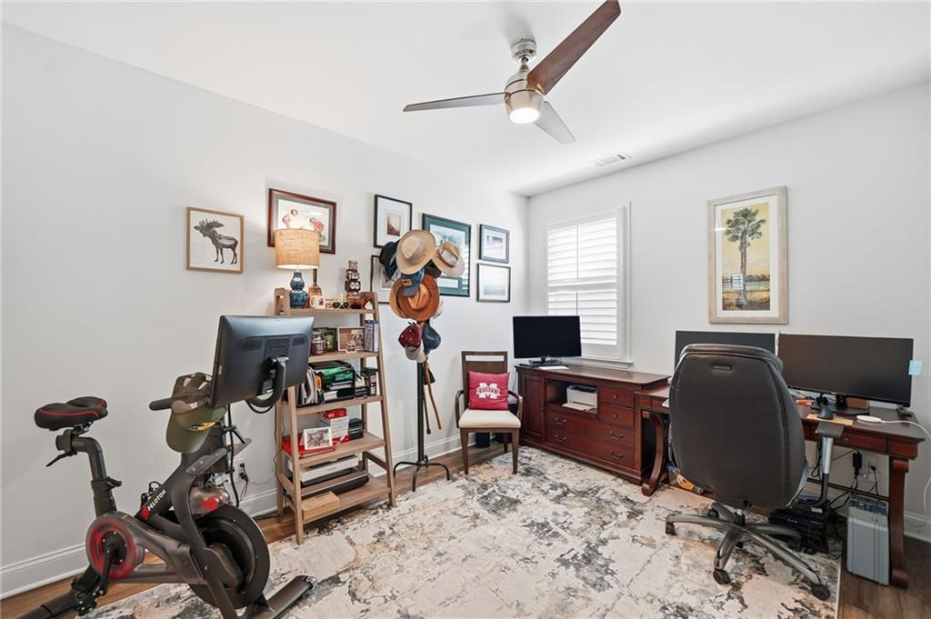 707 Evergreen Lane Canton, GA 30114 - Photo 9 of 59 a view of a workspace with furniture and a window