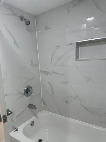 a bathroom with a sink and a shower