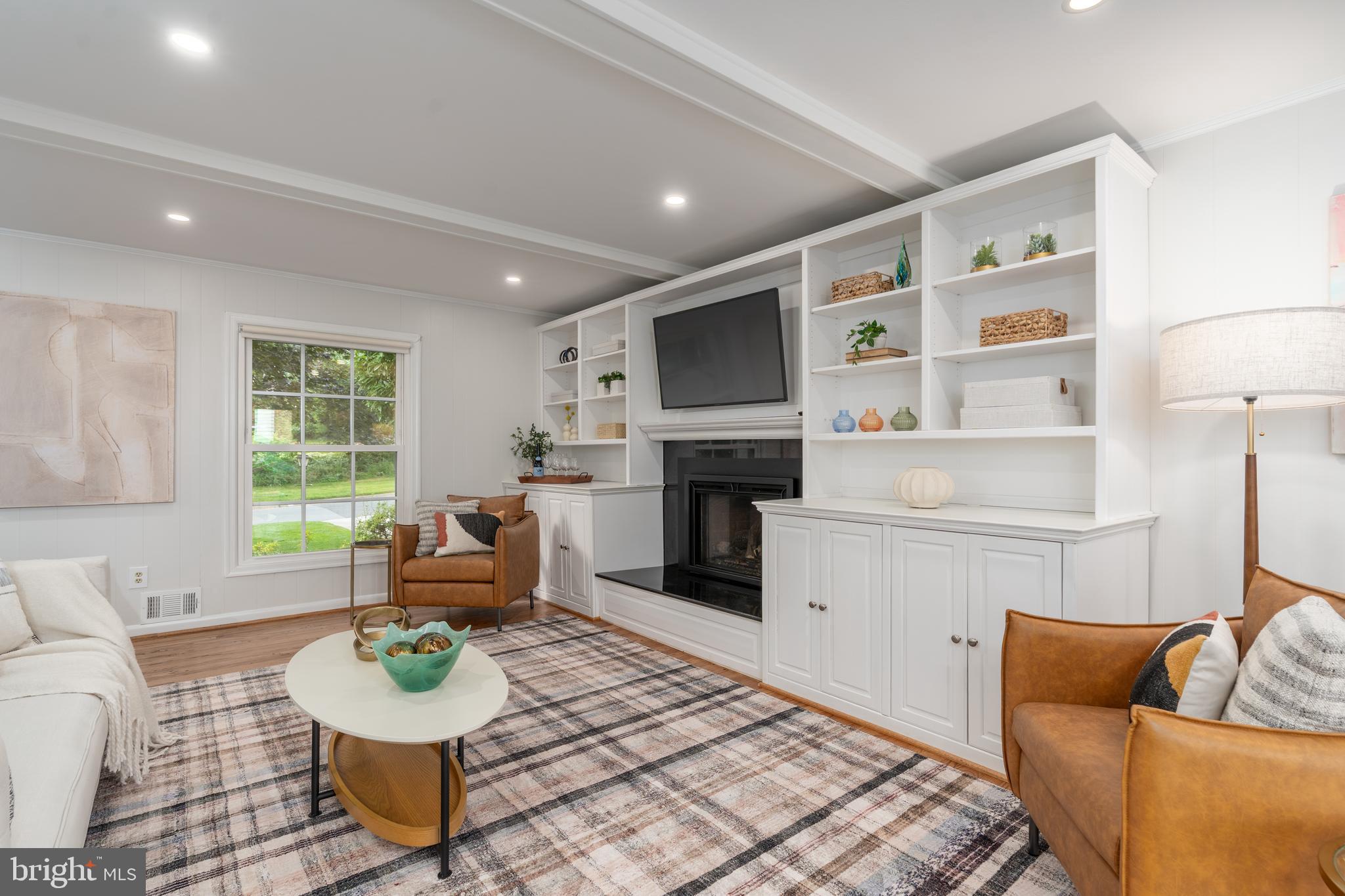 8712 Fox Run Potomac, MD 20854 - Photo 14 of 49 a living room with furniture and a fireplace