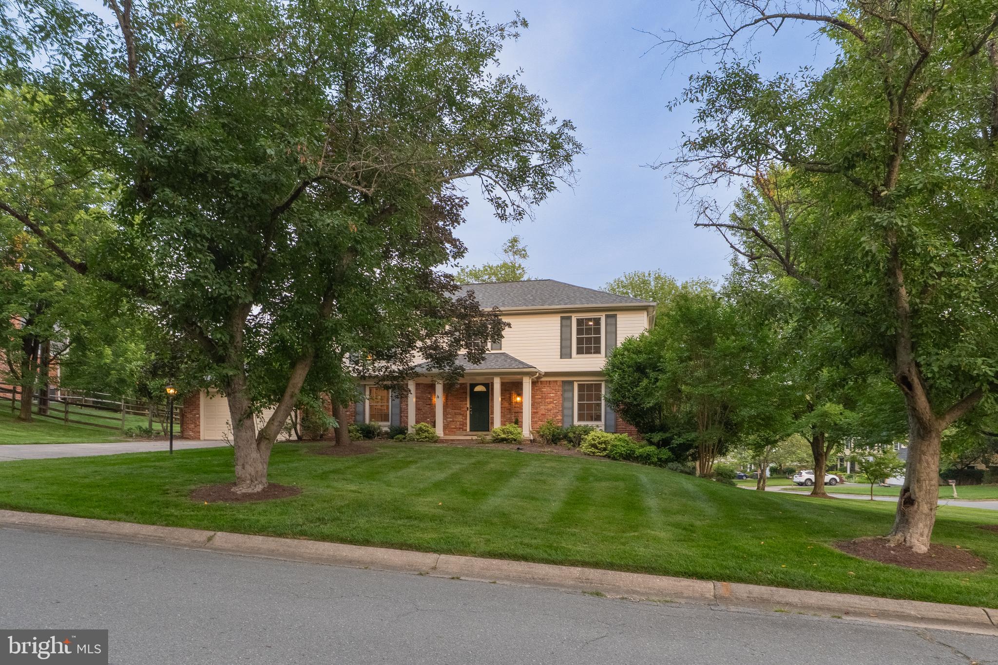 8712 Fox Run Potomac, MD 20854 - Photo 3 of 49 a front view of a house with a yard
