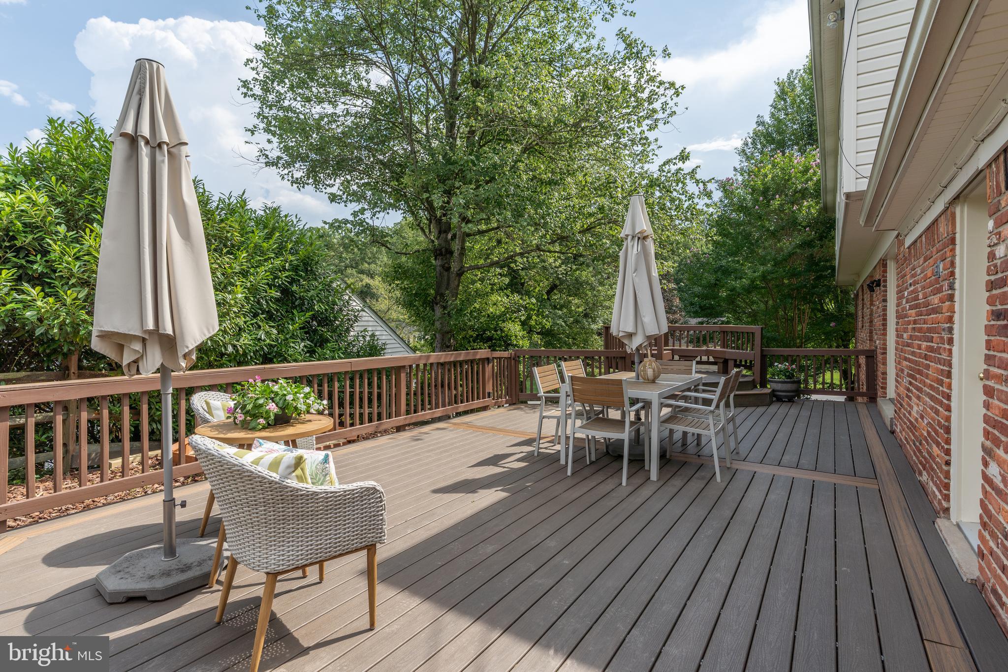 8712 Fox Run Potomac, MD 20854 - Photo 45 of 49 a view of a patio with wooden floor and outdoor seating