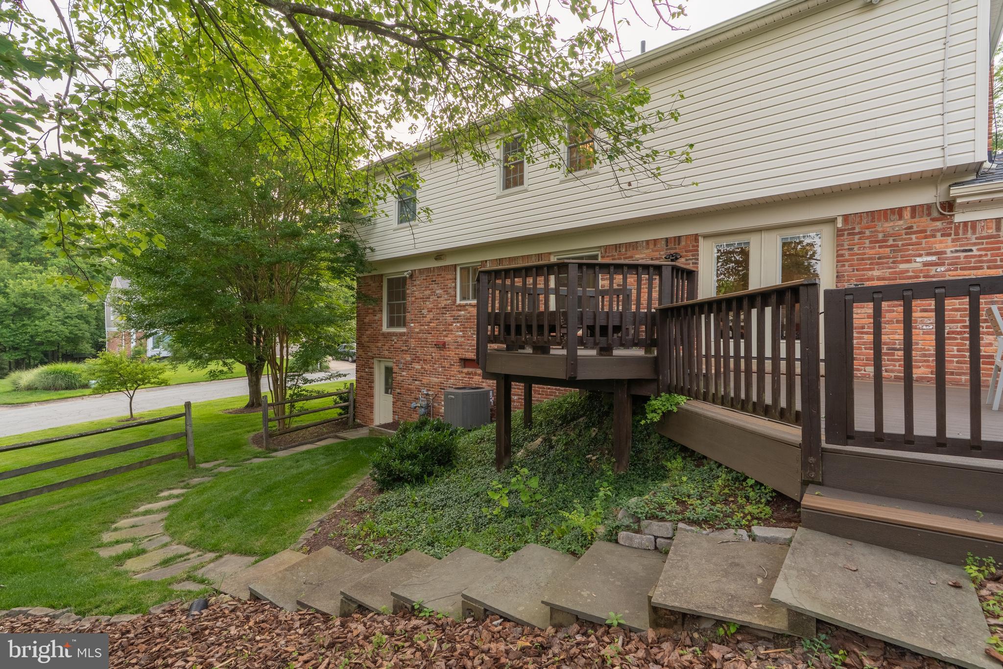 8712 Fox Run Potomac, MD 20854 - Photo 46 of 49 a view of a chair and table in the backyard