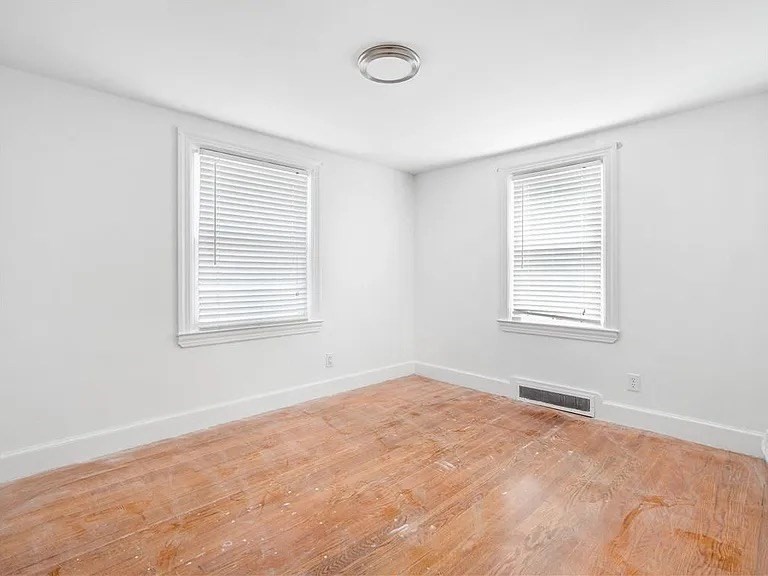 85 Manistee Street Pawtucket, RI 02861 - Photo 7 of 12 an empty room with a window