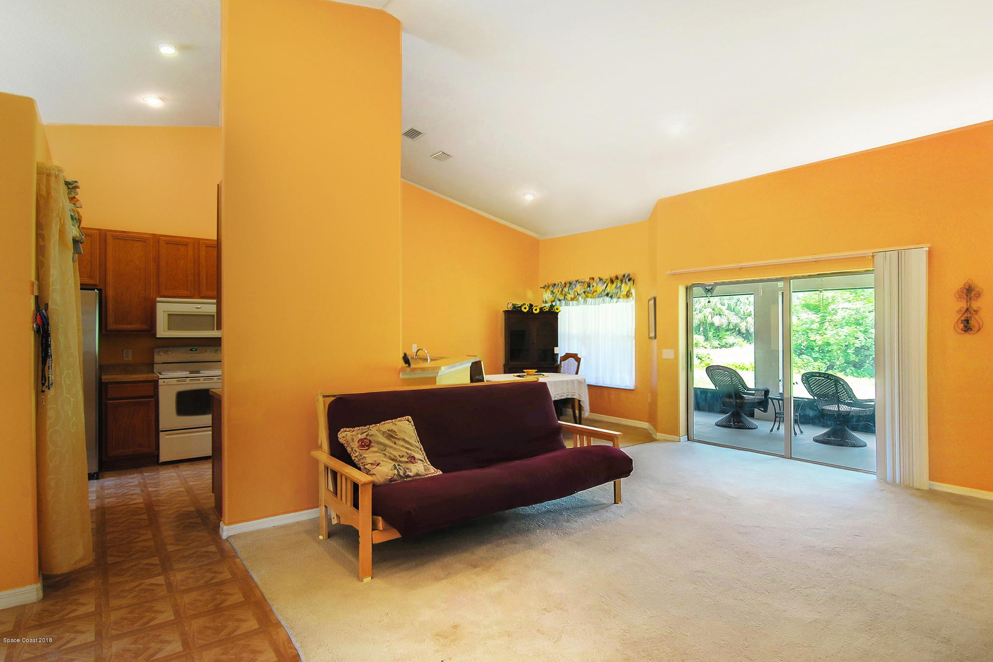 1317 Degroodt Road Southwest Palm Bay, FL 32908 - Photo 12 of 26 a balcony with furniture and a terrace