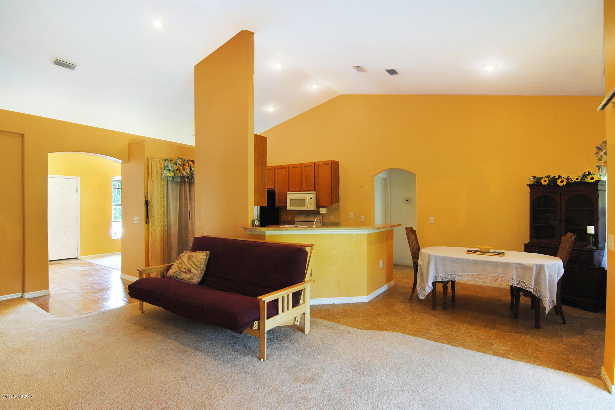 1317 Degroodt Road Southwest Palm Bay, FL 32908 - Photo 13 of 26 a living room with furniture and a table