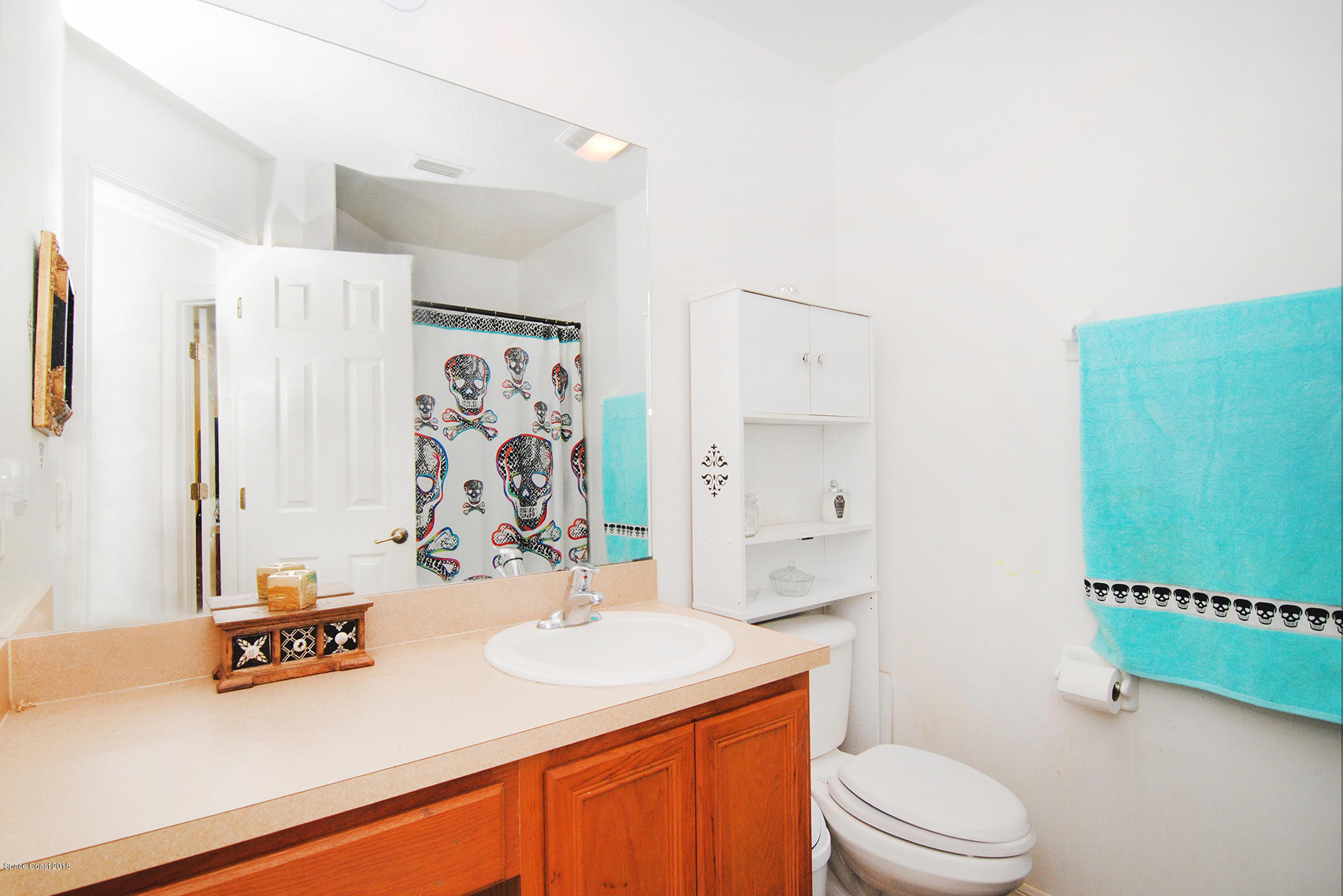 1317 Degroodt Road Southwest Palm Bay, FL 32908 - Photo 19 of 26 a bathroom with a sink a toilet and shower