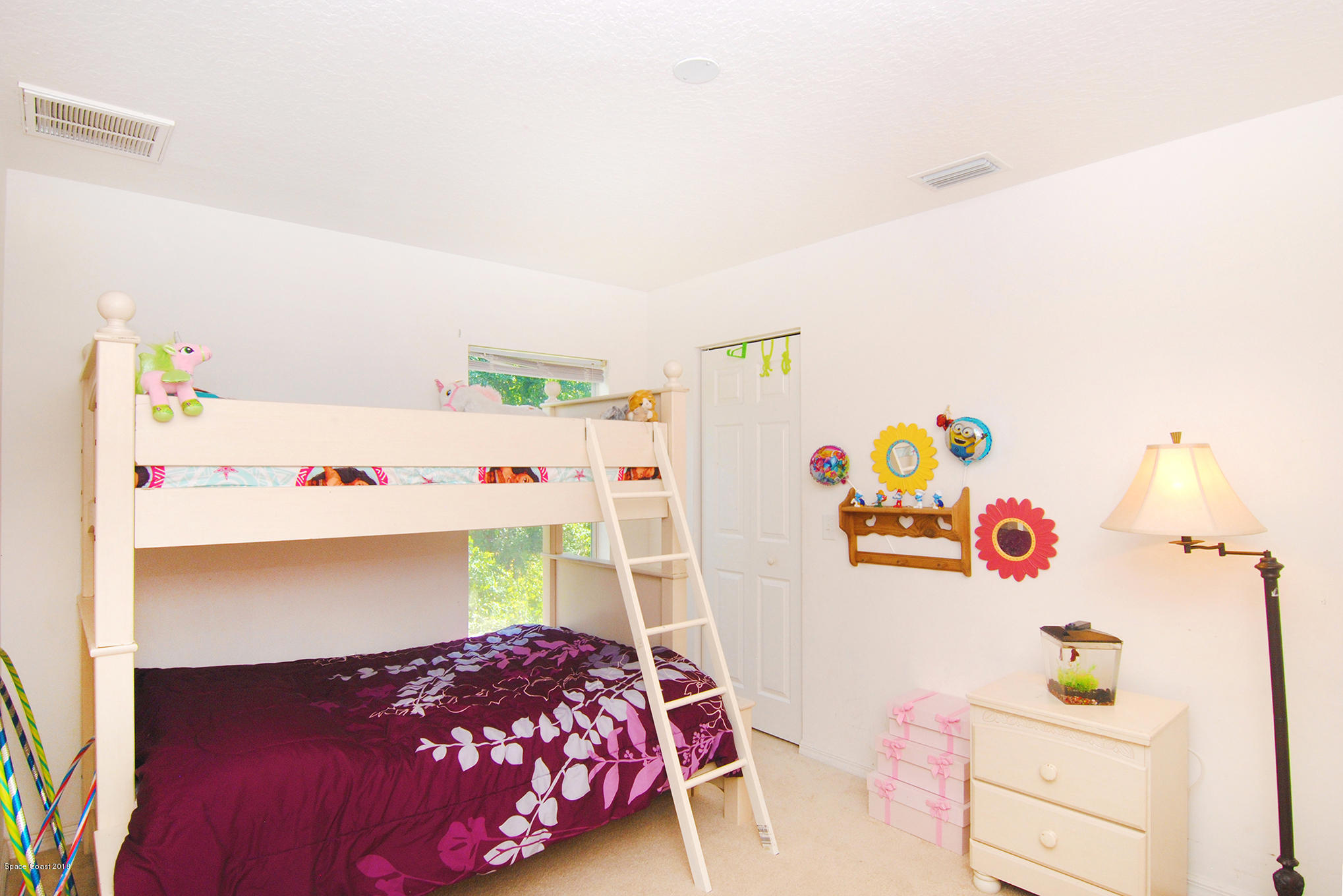 1317 Degroodt Road Southwest Palm Bay, FL 32908 - Photo 21 of 26 a bedroom with a bed and a bed