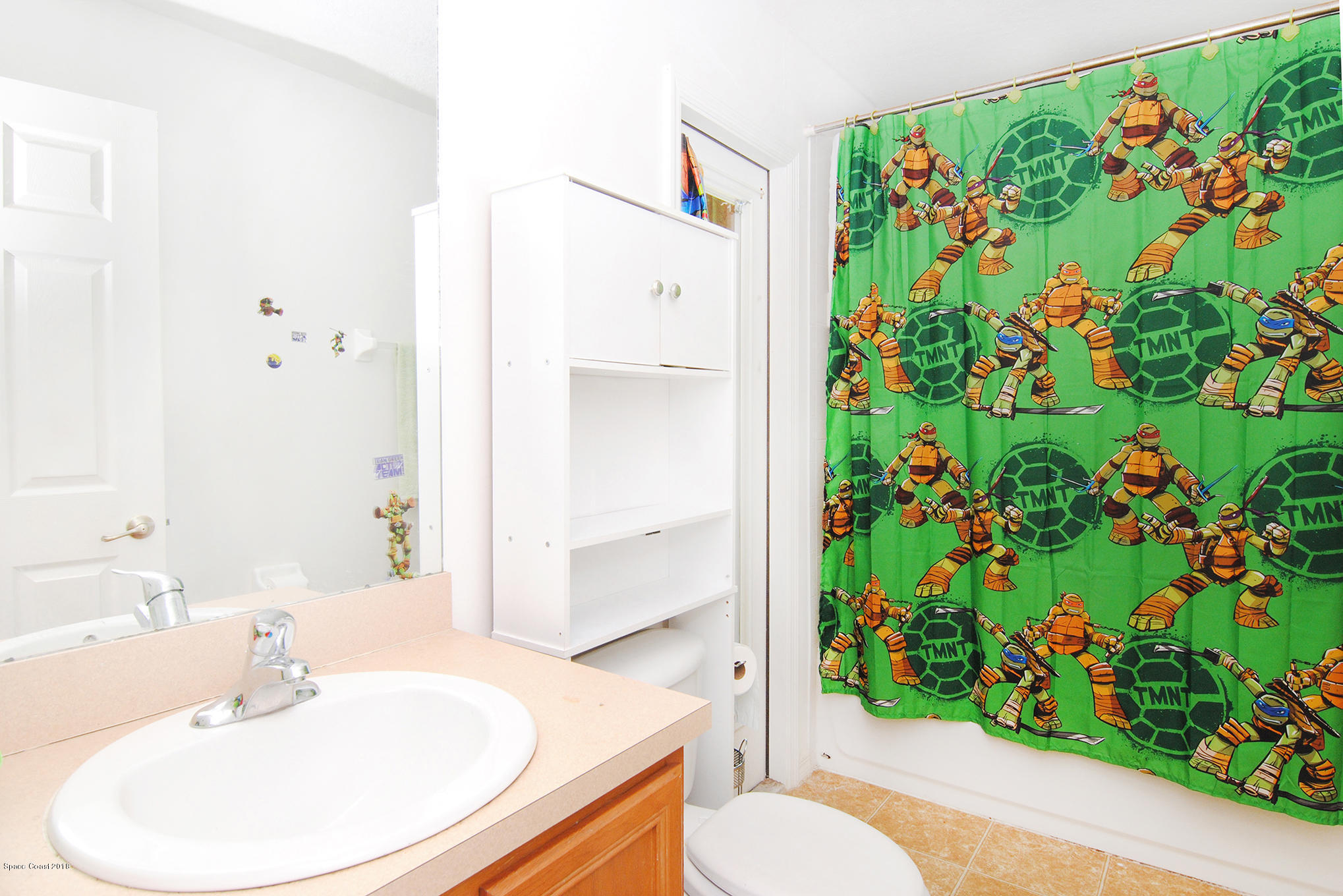 1317 Degroodt Road Southwest Palm Bay, FL 32908 - Photo 23 of 26 a bathroom with a sink and a mirror