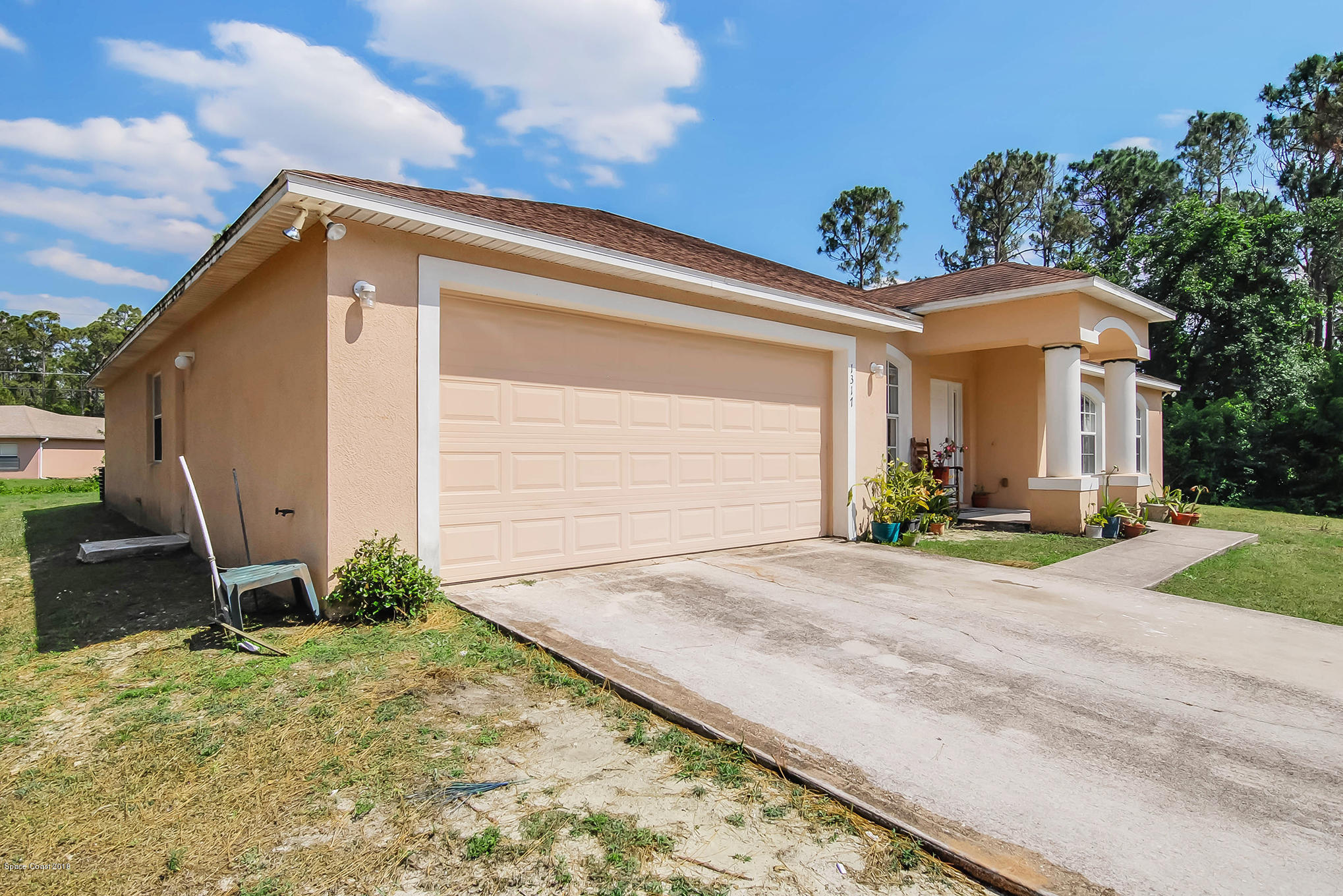1317 Degroodt Road Southwest Palm Bay, FL 32908 - Photo 4 of 26 a view of a house with backyard and garden