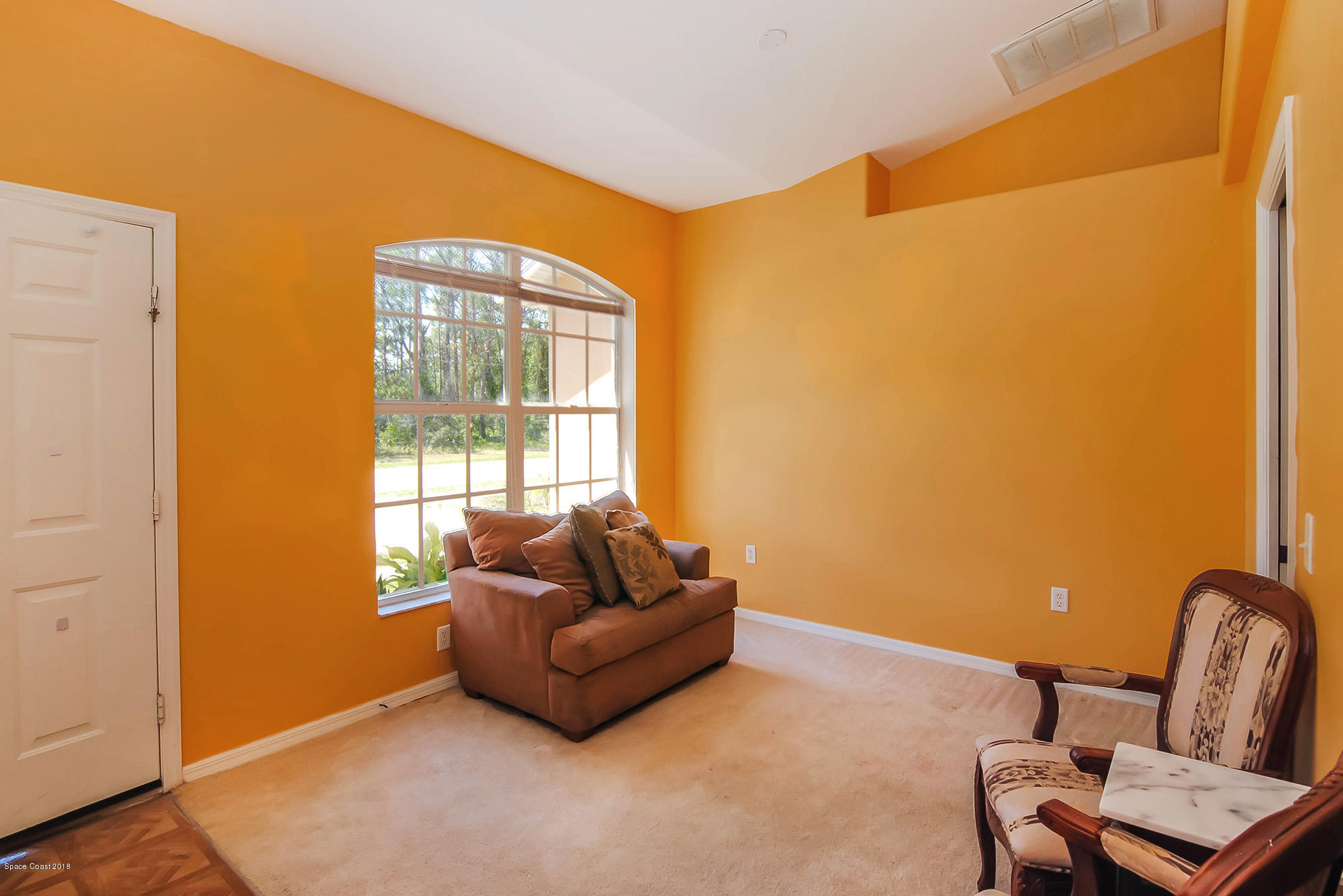 1317 Degroodt Road Southwest Palm Bay, FL 32908 - Photo 5 of 26 a living room with furniture and a window