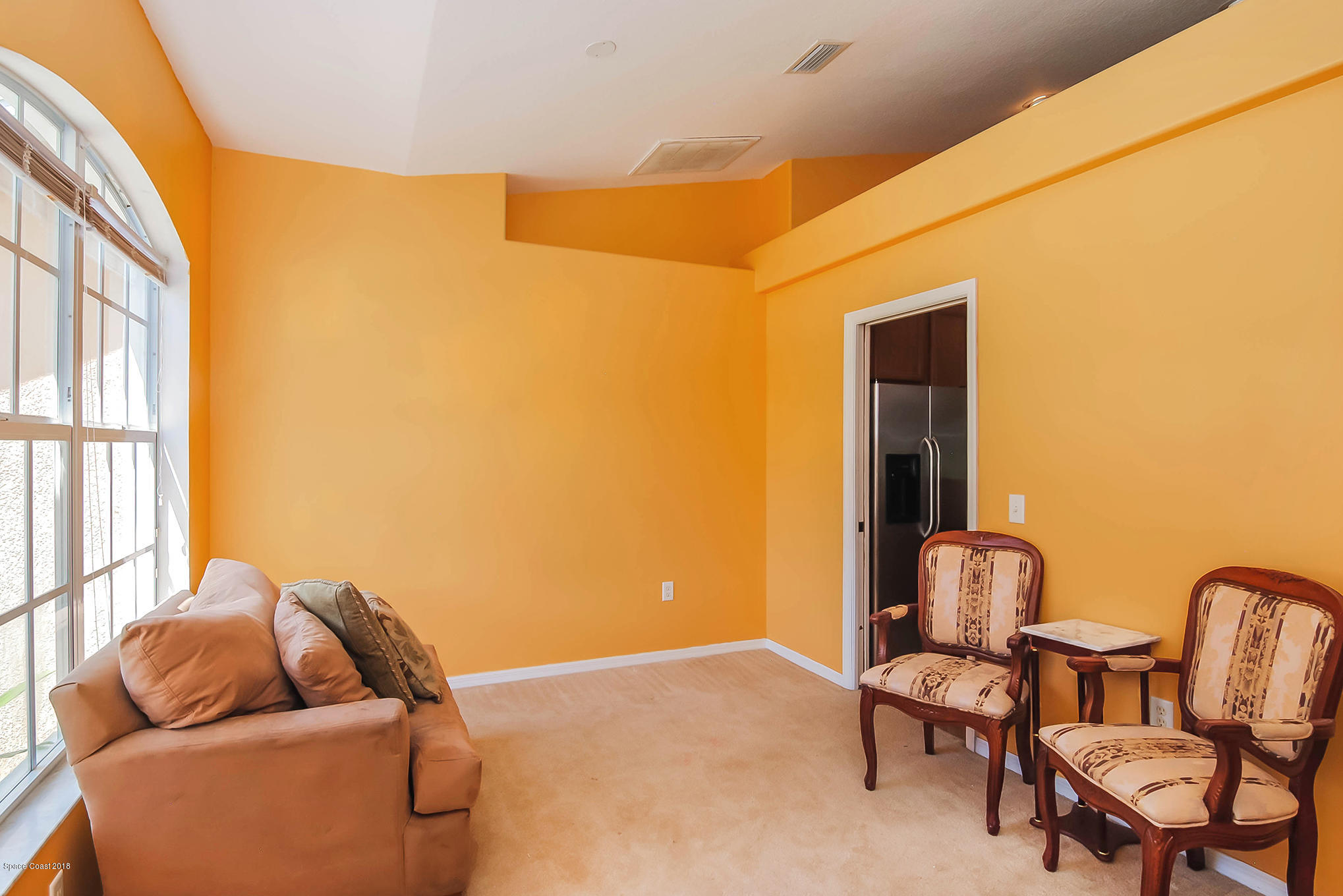 1317 Degroodt Road Southwest Palm Bay, FL 32908 - Photo 6 of 26 a living room with furniture and a window