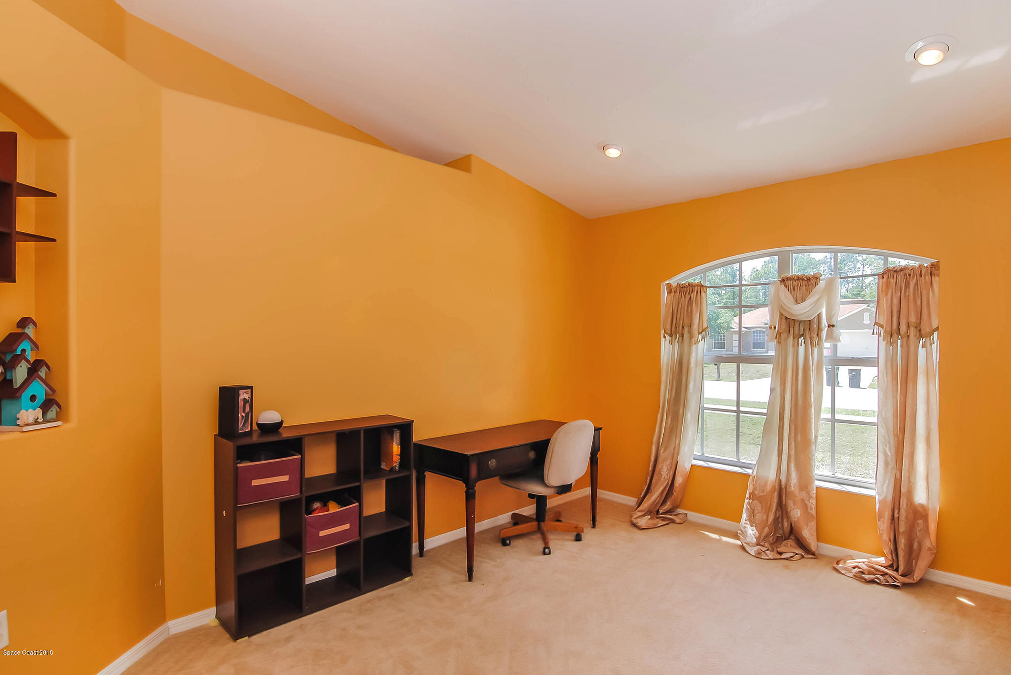 1317 Degroodt Road Southwest Palm Bay, FL 32908 - Photo 7 of 26 a view of a room with workspace and windows