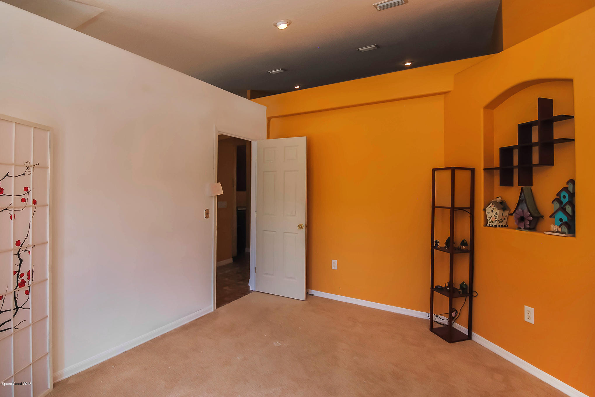 1317 Degroodt Road Southwest Palm Bay, FL 32908 - Photo 8 of 26 a view of an empty room with wooden floor