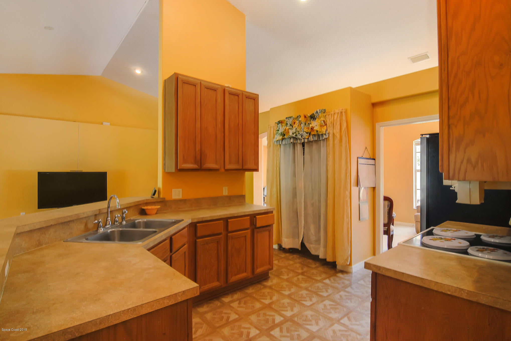 1317 Degroodt Road Southwest Palm Bay, FL 32908 - Photo 9 of 26 a room with a chair and appliances