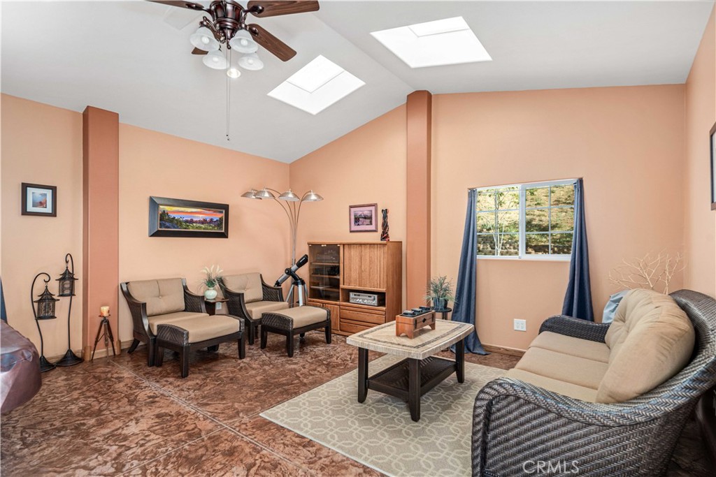 9251 Elizabeth Lake Road Leona Valley, CA 93551 - Photo 36 of 53 a living room with furniture and a large window