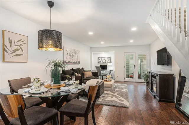 a kitchen with granite countertop a sink stainless steel appliances and cabinets