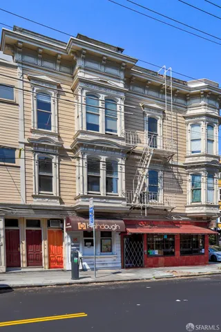 a tall building on the side of a street