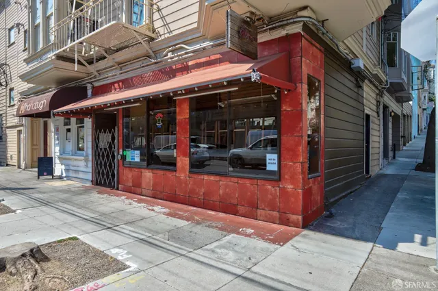 a view of shops on a street