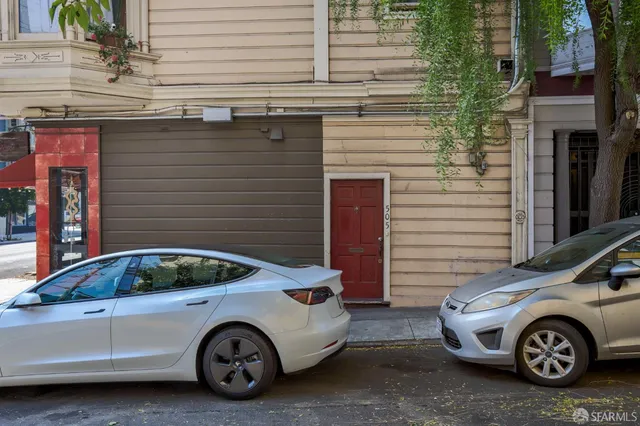 a front view of a house with parking space