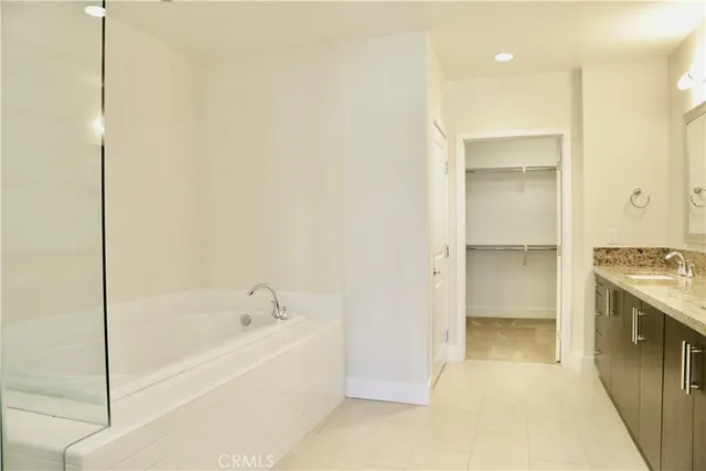 a bathroom with a bathtub and a sink